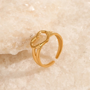 Minimalist gold heart ring with open band on white stone, vintage style jewelry