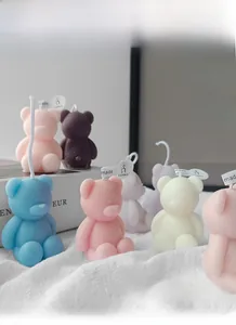 Detailed view of mini bear-shaped aromatherapy candles in assorted Morandi colors