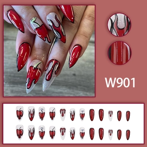 Red and silver stiletto press-on nails with cherry flame and polka dot artistic designs