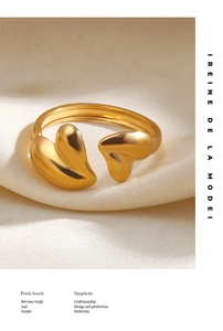 Macro shot of 18K gold-plated adjustable ring featuring asymmetric heart-shaped ends