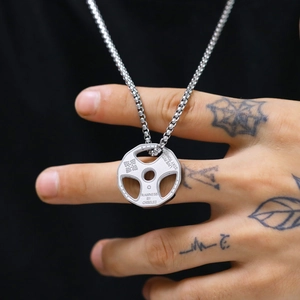 Polished silver barbell plate necklace with engraved motivational text and dumbbell icon