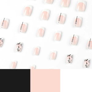 Short French white press-on nails with black flower and leaf designs in a neat array