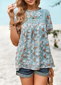 Close-up of blue floral print top featuring delicate lace splicing on the shoulders