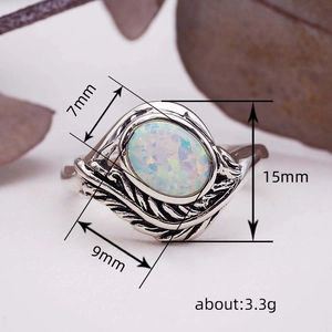 Bohemian vintage leaf branch ring with oval fire opal and oxidized silver finish