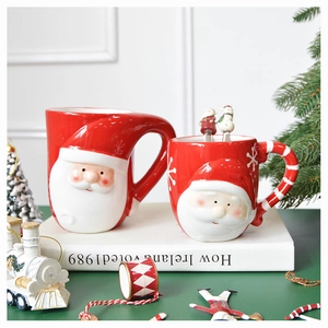 Detail view of 3D embossed Santa Claus ceramic mugs with festive red and white patterns