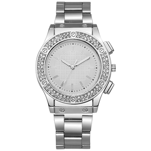 Close-up of silver quartz watch with crystal-encrusted bezel and metallic link strap