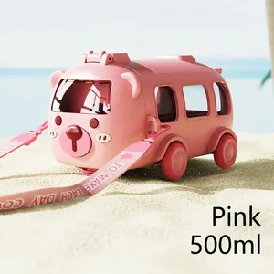 Pink cartoon bear bus straw water bottle with adjustable strap on a sunny summer beach