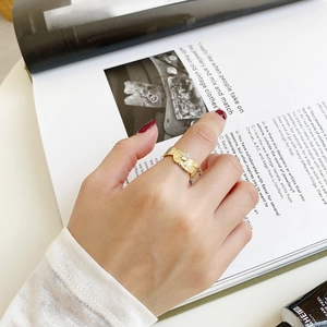Irregular textured S925 silver ring in gold finish with a central sparkling zircon
