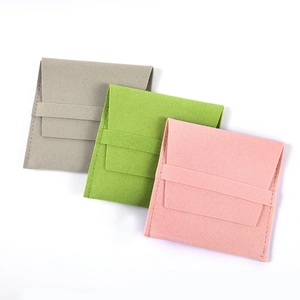 Set of three premium microfiber jewelry pouches in pink, grey and green with drawstring