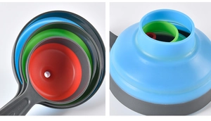 Detail of colorful nested silicone funnels in grey blue green and red for kitchen storage