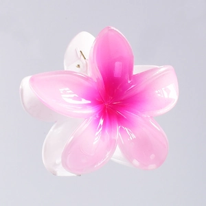 Detailed macro view of 7cm pink gradient frangipani hair claw with high-gloss finish