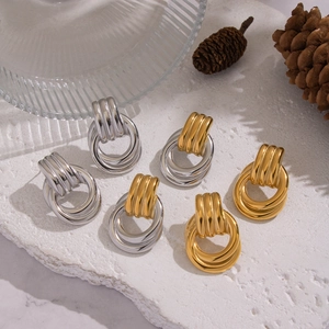 Three pairs of geometric interlocking mixed-color stainless steel hoop earrings for women