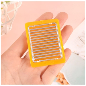 Miniature kitchen grill rack for dollhouse with yellow frame and silver metal bars
