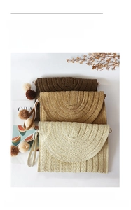 Detail of straw woven clutches in three colors with plush pompom zipper accessories