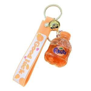 Creative orange soda bottle keychain with metal bell and Good Luck wrist strap