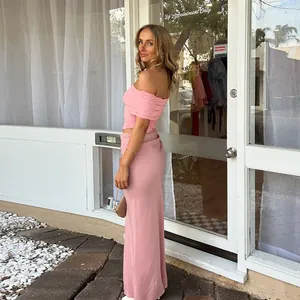 Elegant two-piece set featuring pink off-shoulder pleated top and slim-fit long skirt