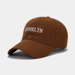 Brown cotton baseball cap with white Brooklyn embroidery shown at a 45-degree angle