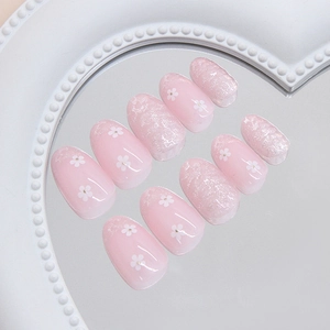 Press-on nail set with purple floral patterns and silver glitter on heart-shaped mirror tray