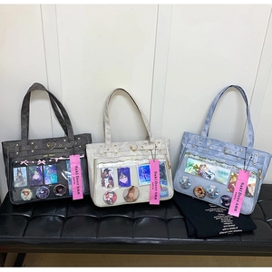 Detail view of large Oxford ita bags in three colors with transparent display windows