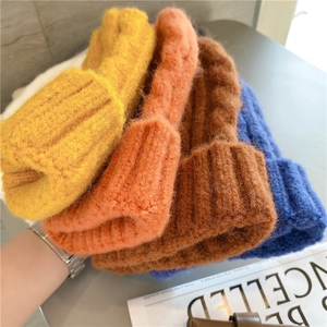 Thick cable knit beanie hats in multiple colors featuring soft texture and warm yarn