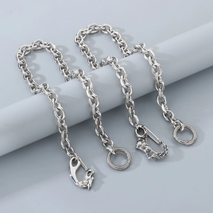 Punk style stainless steel waist chain set with detailed wolf head hooks on gray stand