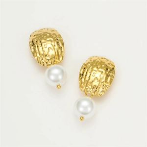 Detail of square hammered 18K gold stainless steel earrings with freshwater pearl drop