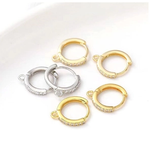 Macro detail of 18k gold and silver plated DIY earring hooks with cubic zirconia crystals