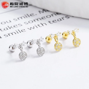 Detail of 925 silver bow earrings with zircon round pendants and screw back closure