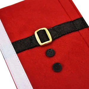 Detail of Christmas fridge door handle cover featuring red felt fabric and black belt buckle