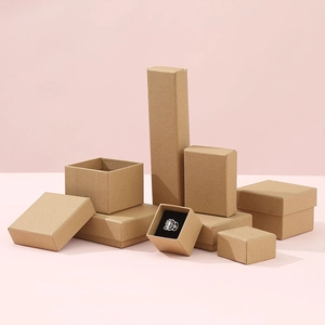 Various sizes of kraft paper jewelry boxes with black sponge liners and ring display