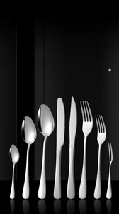 Polished stainless steel cutlery set with thick design on a reflective black background
