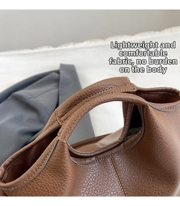 Detailed close-up of brown litchi pattern leather texture and strap stitching details