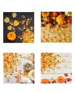 Macro shot of glittery hollow pumpkin confetti and colorful dots for Thanksgiving party decor
