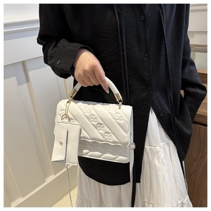 White embossed shoulder bag with quilted flower pattern and mini coin purse detail