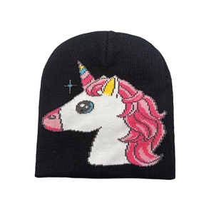 Detailed close-up of unicorn knit pattern on black cozy beanie for children