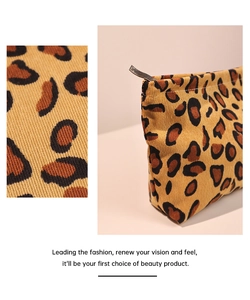 Close-up of leopard print corduroy fabric texture and spacious travel makeup bag design