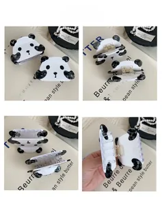 Detail of cute panda hair claw clip showing strong metal spring and multi-tooth grip design