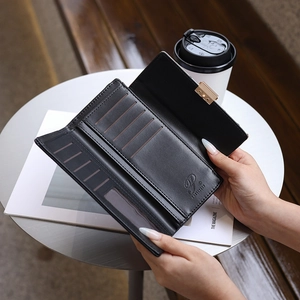 Internal details of black leather long wallet showing card slots and transparent ID window