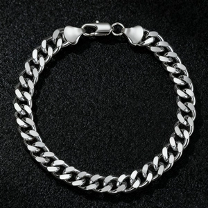 Close-up of a silver stainless steel Cuban link bracelet with a secure lobster clasp