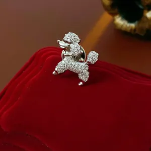 Elegant silver puppy brooch with white zircon inlay on red velvet jewelry gift box