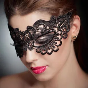 Close-up of intricate black lace masquerade mask with gold stamping for Halloween party