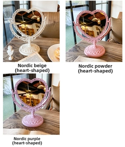 Vintage heart-shaped rotating makeup mirrors in beige, pink and purple colors