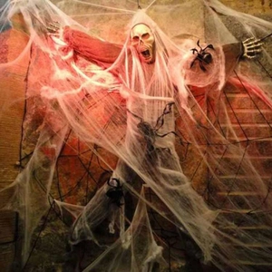 Spooky Halloween scene with glowing skull in spider web and large hanging spiders