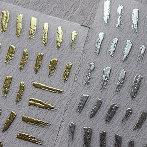 3D metallic gold and silver nail art stickers with embossed abstract brush stroke patterns