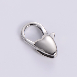 Close-up of polished stainless steel heart-shaped lobster clasp connector for jewelry