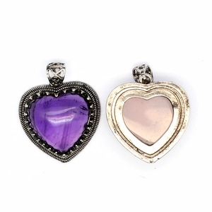 Macro view showing both front and back of heart-shaped natural amethyst stone pendant