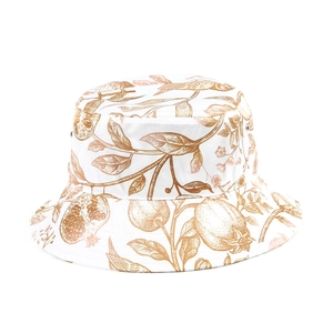 Detail of floral printed sun hat with metal eyelets and vintage botanical patterns