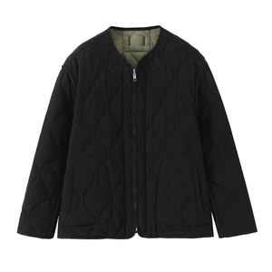 Women's reversible quilted jacket in black with green lining and onion stitching