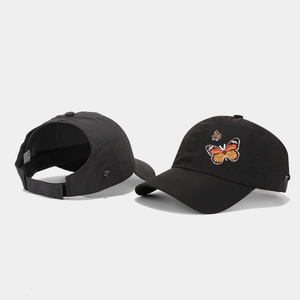 Black ponytail baseball cap with butterfly embroidery and breathable mesh cutout