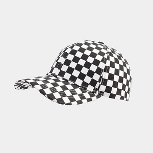 Detail shot of the black and white checkerboard pattern on a classic baseball cap fabric